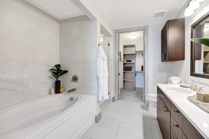 Spa-inspired baths with dual vanity sinks, separate showers and soaking tubs