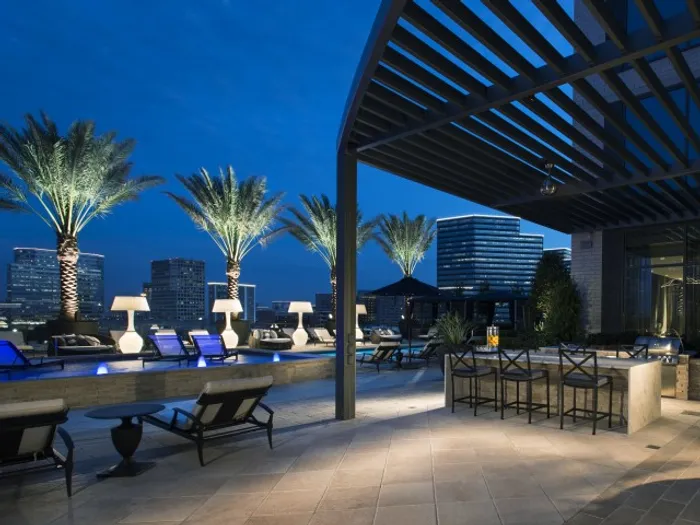 City skyline view from the poolside outdoor grilling and dining area
