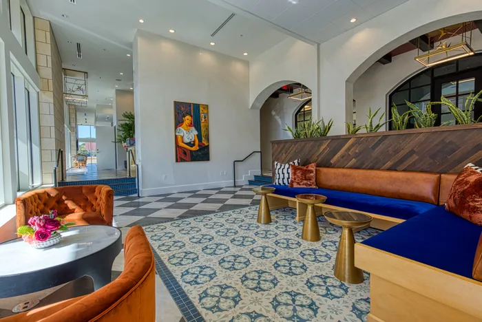 Ample coworking space with private meeting rooms and banquette seating
