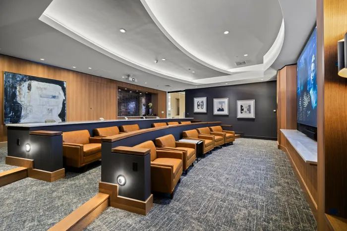 screening lounge with HD projector and cinema-style seating