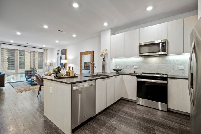 Chef-inspired kitchen with premium appliances, a spacious island and premium granite countertops