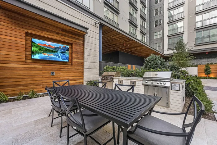 grills with outdoor dining table and outdoor TV