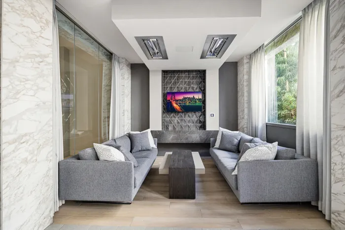 outdoor lounge with tv and sofas