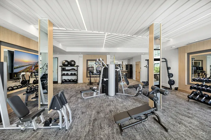 fitness center with free weights and weight machines