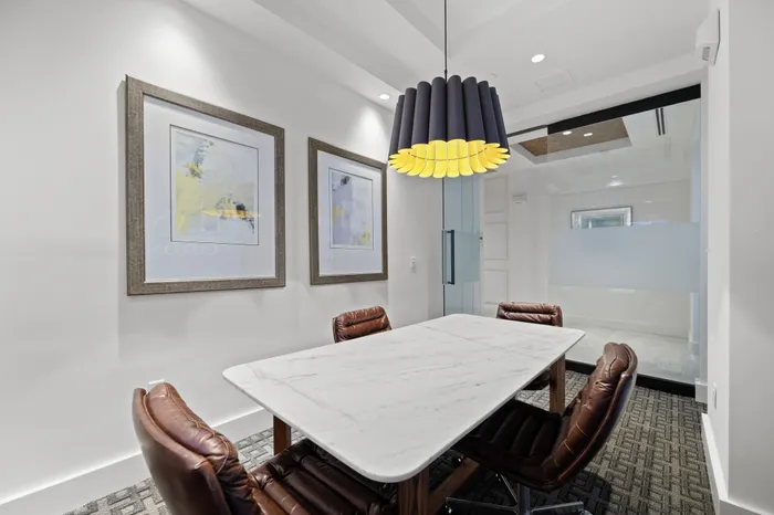 small conference room with pendant light, marble table and 4 chairs
