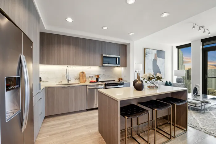 kitchen with firdge, stove, oven, cabinets and kitchen island