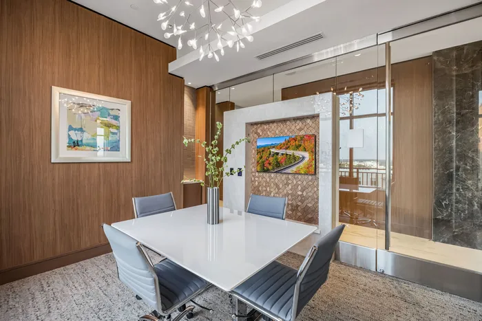 Conference room with a square table and four chair sitting