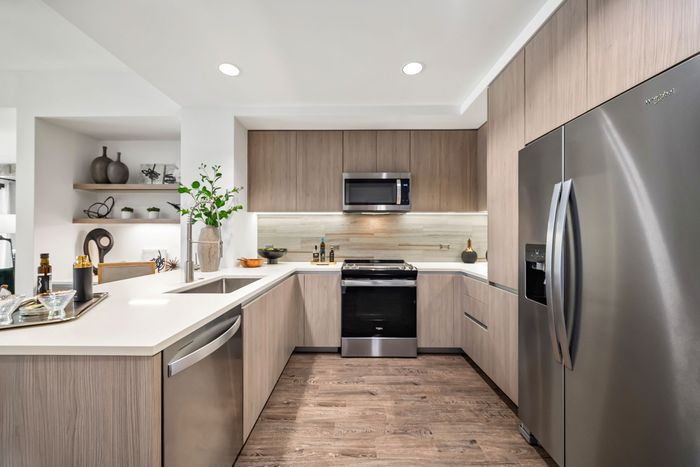 Kitchen with an oven, microwave and a refrigerator