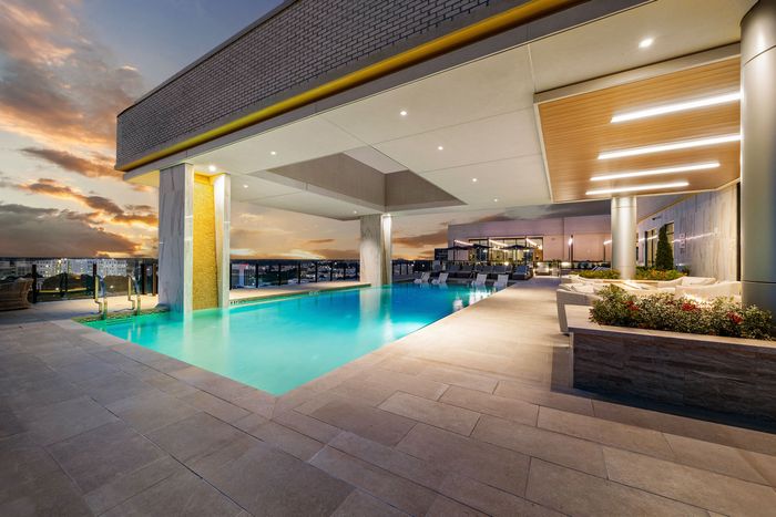 Resort style pool on the terrace with fireplaces overlooking the Dilworth skyline