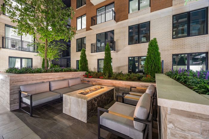 Sofa sitting with centre fireplace in the courtyard