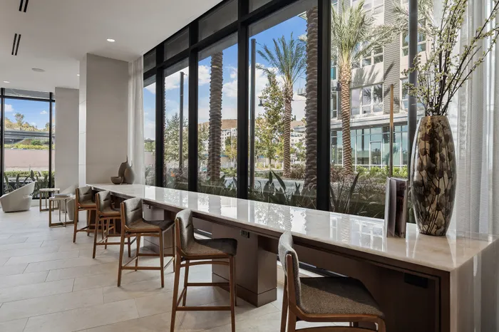 elounge with floor to ceiling windows and counter seating with power outlets at all 5 chairs