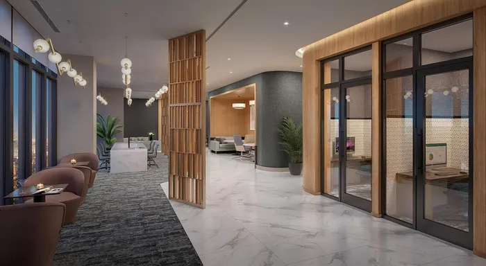 Sophisticated modern lobby with elegant lighting, cozy seating areas, and private workspaces, offering a luxurious and inviting atmosphere.
