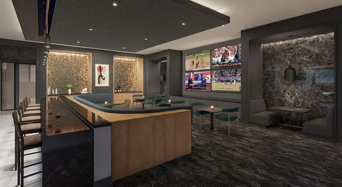 Elegant entertainment lounge with sleek bar seating, modern decor, and multiple flat-screen TVs, ideal for social gatherings.