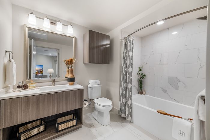 Elegant and modern bathroom with stylish vanity, chic decor, and luxurious marble finishes.