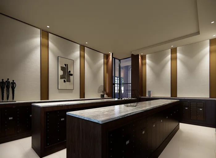 Elegant lobby with modern decor, featuring dark wood accents, stylish artwork, and ambient lighting for a luxurious ambiance.
