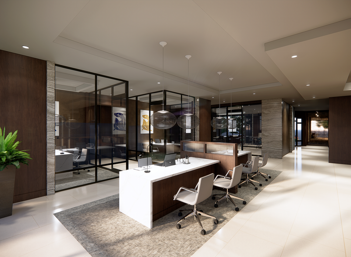 Modern office lobby featuring sleek workstations, glass partitions, and stylish lighting fixtures.