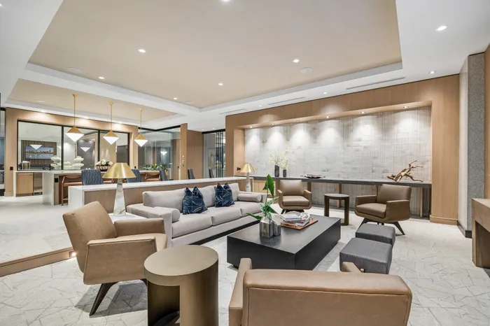 Elegant lounge area with modern seating, stylish lighting, and a sophisticated open-concept design that blends luxury and comfort.