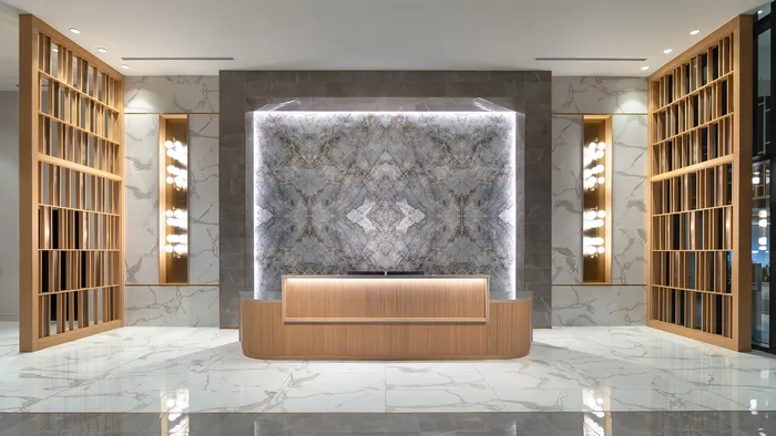 Luxurious modern lobby with elegant marble accents, stylish wood paneling, and ambient lighting.