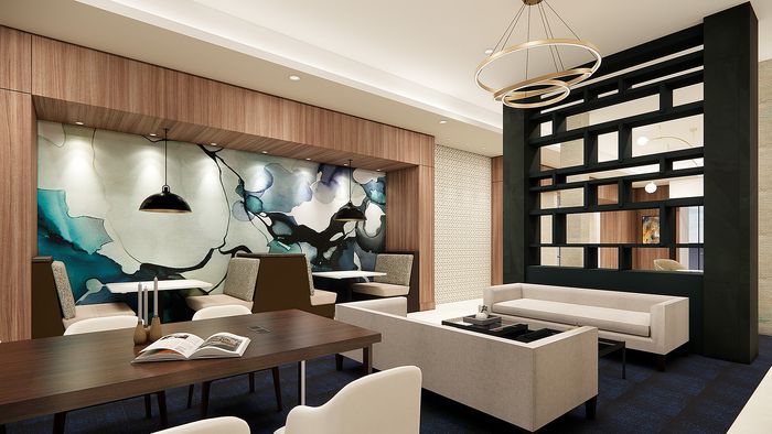 Sophisticated lounge area with modern pendant lighting, chic printed wall art, elegant seating, and a contemporary partition.
