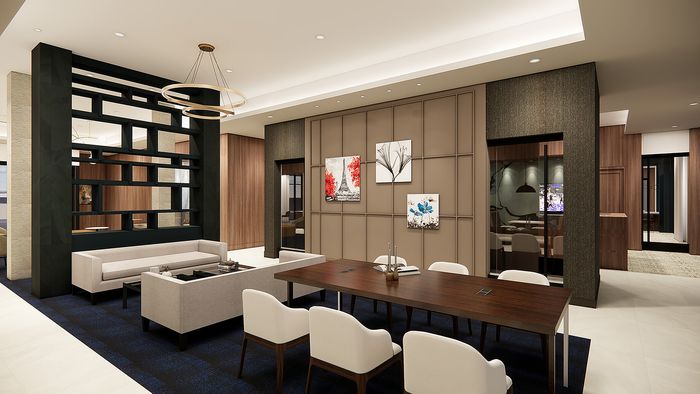 Modern and elegant open-concept lounge showcasing sophisticated decor, chic seating, and vibrant artwork.