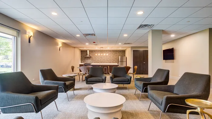 Gather, socialize, and relax in our tastefully decorated community clubhouse with comfortable seating areas. | The Glen View | Apartments in Glenview