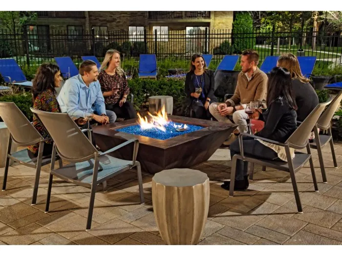 Gather around our community fire pit for evening relaxation, conversation, and marshmallow roasting. | The Glen View | The Glen View Apartments