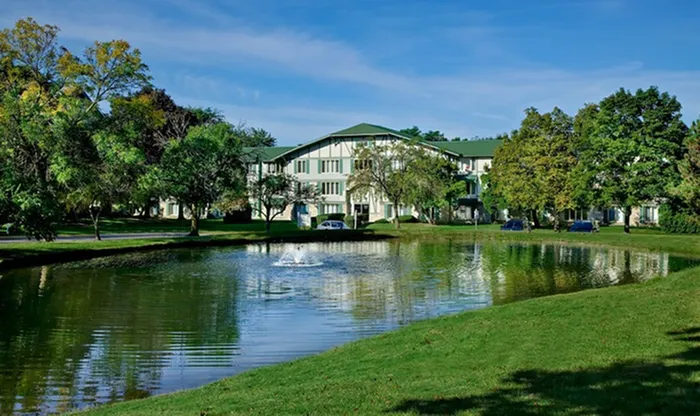 Find tranquility beside our serene koi pond where colorful fish and gentle water sounds create a peaceful natural retreat. |  International Village Lombard | Apartments in Lombard