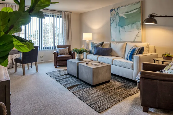 This thoughtfully designed living room maximizes comfort and functionality with smart layout choices. |  International Village Lombard |