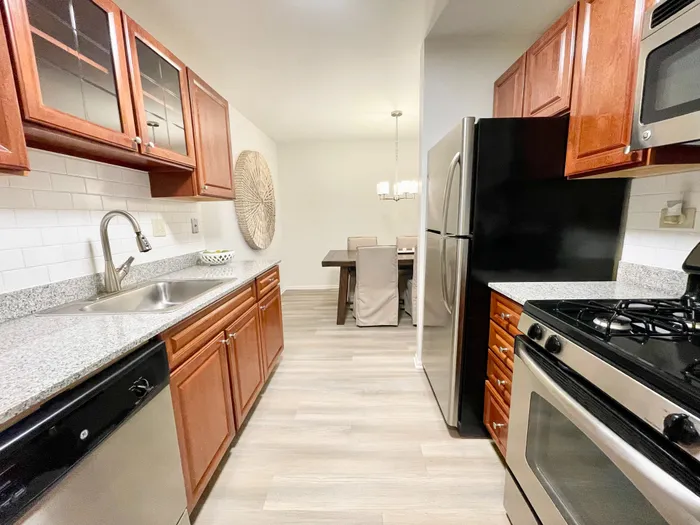 The updated kitchen features fresh finishes, quality appliances, and improved functionality for daily cooking needs.  |  International Village Lombard |  International Village Lombard Apartments
