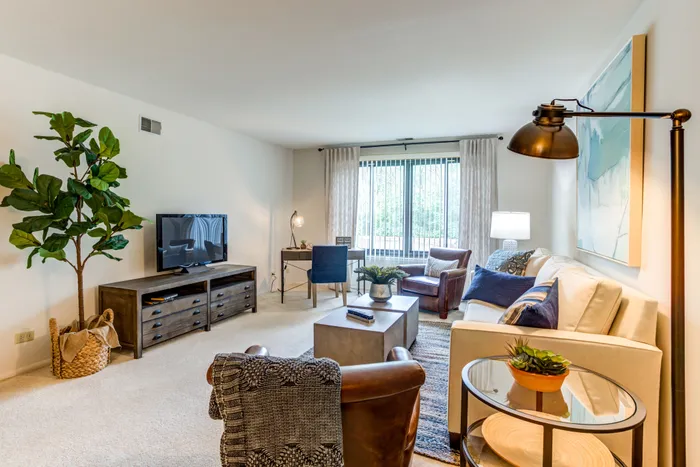 This spacious living room offers plenty of room for relaxation and entertaining with flexible layout options.  | International Village Schaumburg |