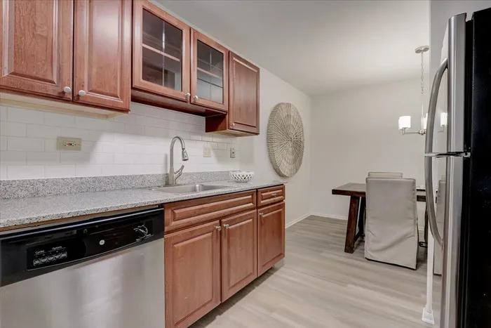 The modern kitchen offers streamlined design with efficient workflow and attractive finishes throughout.  |  International Village Lombard |  International Village Lombard Apartments