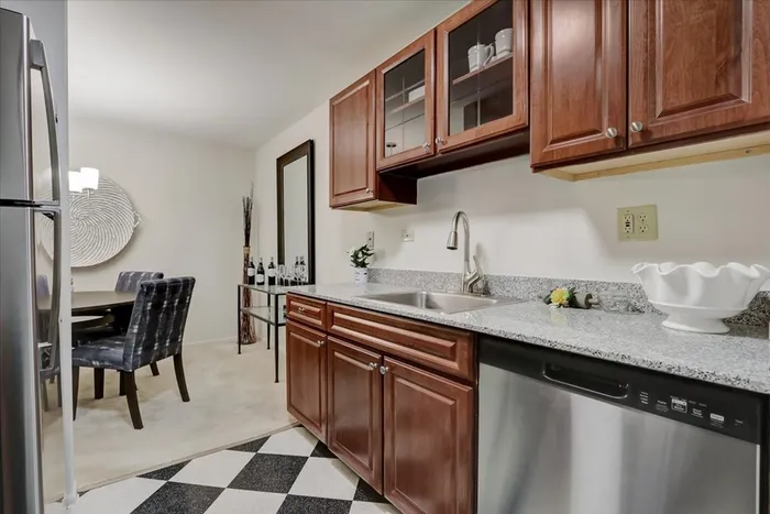 Prepare meals and entertain guests in our community kitchen featuring appliances, prep space, and dining areas. Cooking made convenient.  |  International Village Lombard |  International Village Lombard Apartments