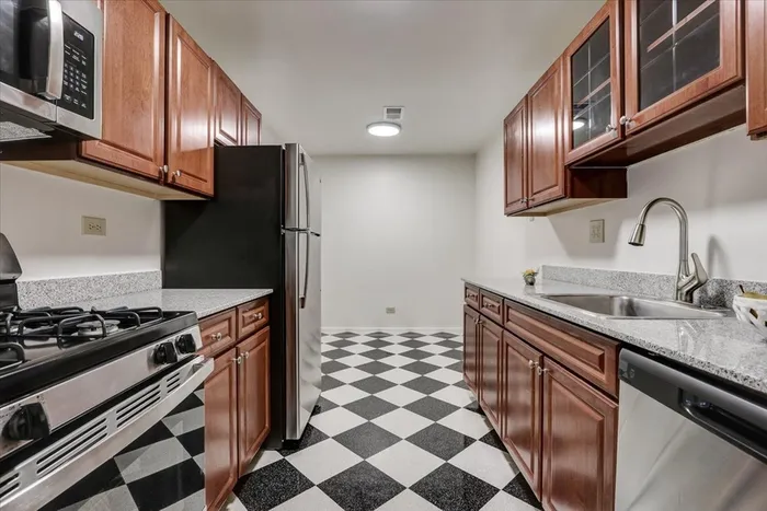 Your spacious kitchen offers generous square footage with room for multiple people and all your cooking essentials.  |  International Village Lombard | Apartments in Lombard