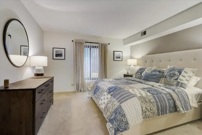 Your primary bedroom suite provides luxurious privacy with ensuite bathroom and walk-in closet convenience.  | International Village Schaumburg | Schaumburg Apartments