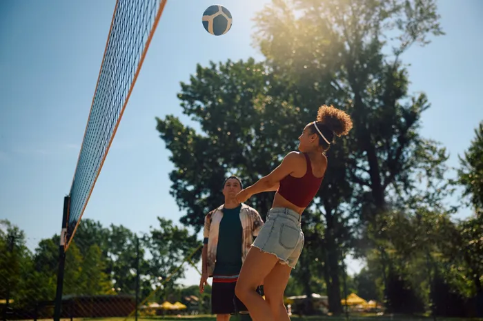 Dive into action at our sand volleyball court featuring a regulation-size playing area. |  International Village Lombard |  International Village Lombard Apartments