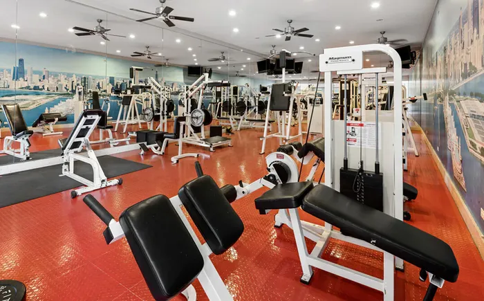 Build strength and endurance in our community fitness center where neighbors come together to pursue their health and fitness journeys. | Lake+House | Lake+House Apartments