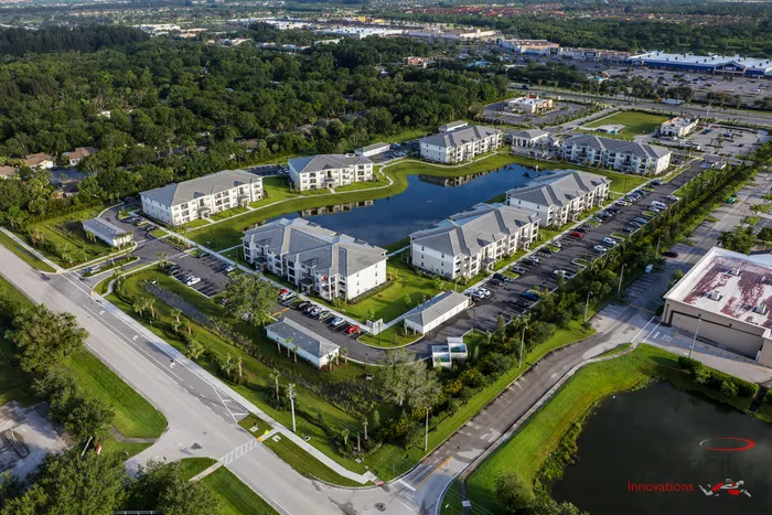 The Reserve at Vero Beach, exterior, aerial view of the property, 7 buildings, pond in the center, landscaped