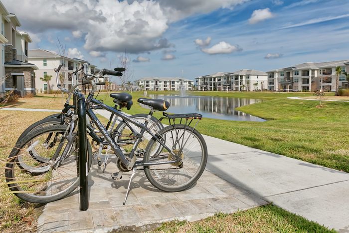 The Reserve at Vero Beach, exterior, view of the pond, view of the other apartment exteriors, bike rack