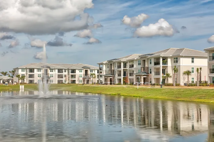 The Reserve at Vero Beach, exterior, pond with fountain, apartment exteriors