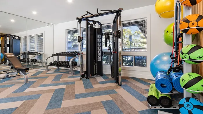 ReNew One59 Fitness center weight area with Exercise Machines, Medicine Balls, and Yoga Equipment