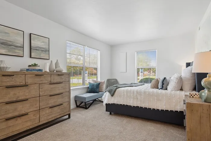 Bedroom at ReNew Virginia Beach with two large windows