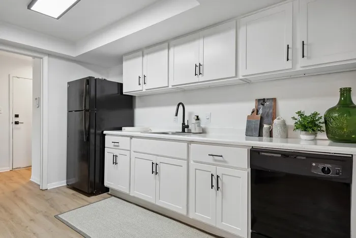 ReNew Virginia Beach kitchen with white cabinets and updated black appliances and new matte black fixtures