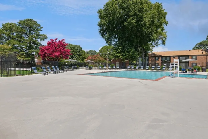 Expansive pool and sundeck at ReNew Virginia Beach with chaise lounge chairs