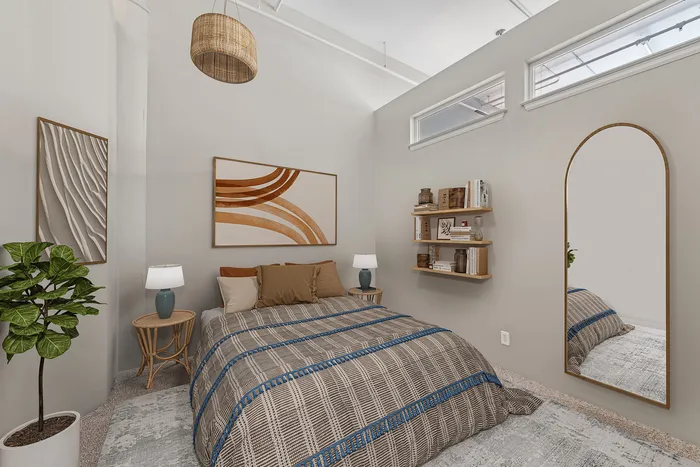 Stylish bedroom interior with a cozy bed, modern art, and natural lighting.
