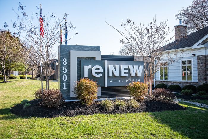 Inviting exterior of reNEW White Marsh with manicured landscaping, creating a welcoming entrance.