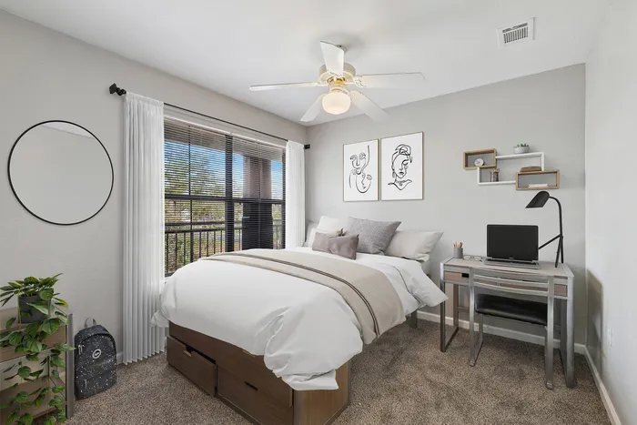 Townhomes at TSC Bedroom with Ceiling Fan and Balcony
