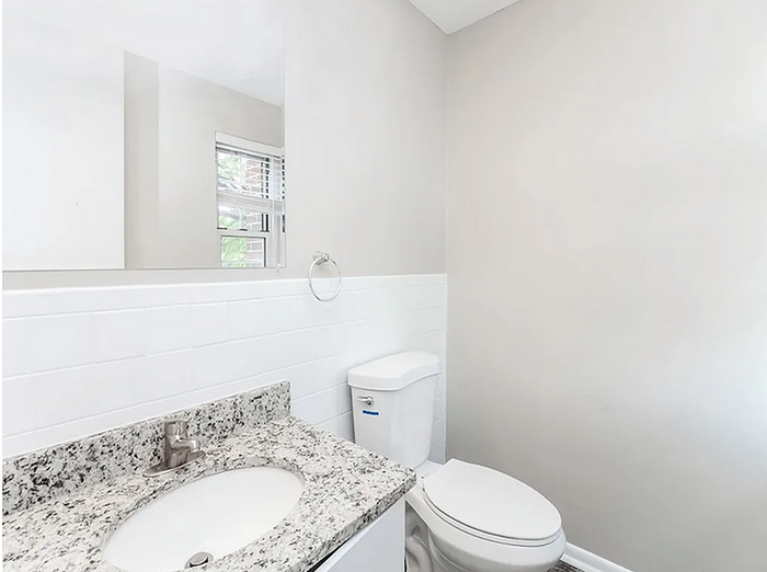 ReNew Bristol Modern Bathroom with Granite Countertops and Bright Lighting