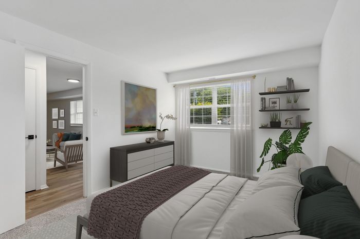 ReNew Parkville Bedroom with Large Window and Modern Finishes