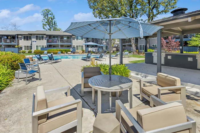 ReNew Berryessa Pool Area with Lounge Chairs and Umbrellas