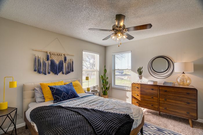 Bright and inviting bedroom featuring modern decor, stylish furnishings, and natural lighting, perfect for serene relaxation.